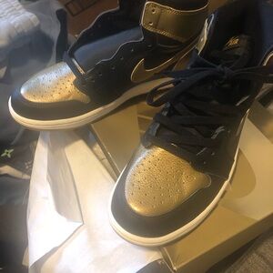 Nike Air Jordan 1 Low Black and Metallic Gold Sneakers